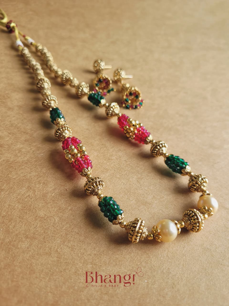Varnika Ruby & Emerald Gold Beaded Necklace & Jhumka Set